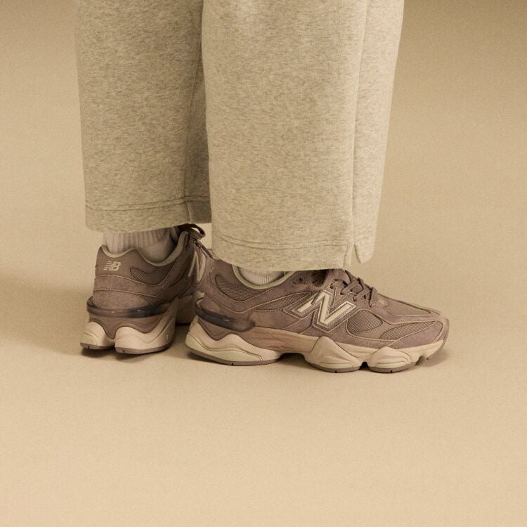 Side profile on-figure shot of the tan and beige shoes.