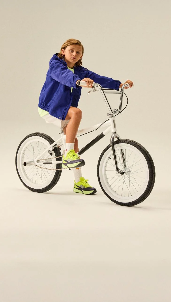 Boy on a bike wearing FuelCell Rebel shoes.