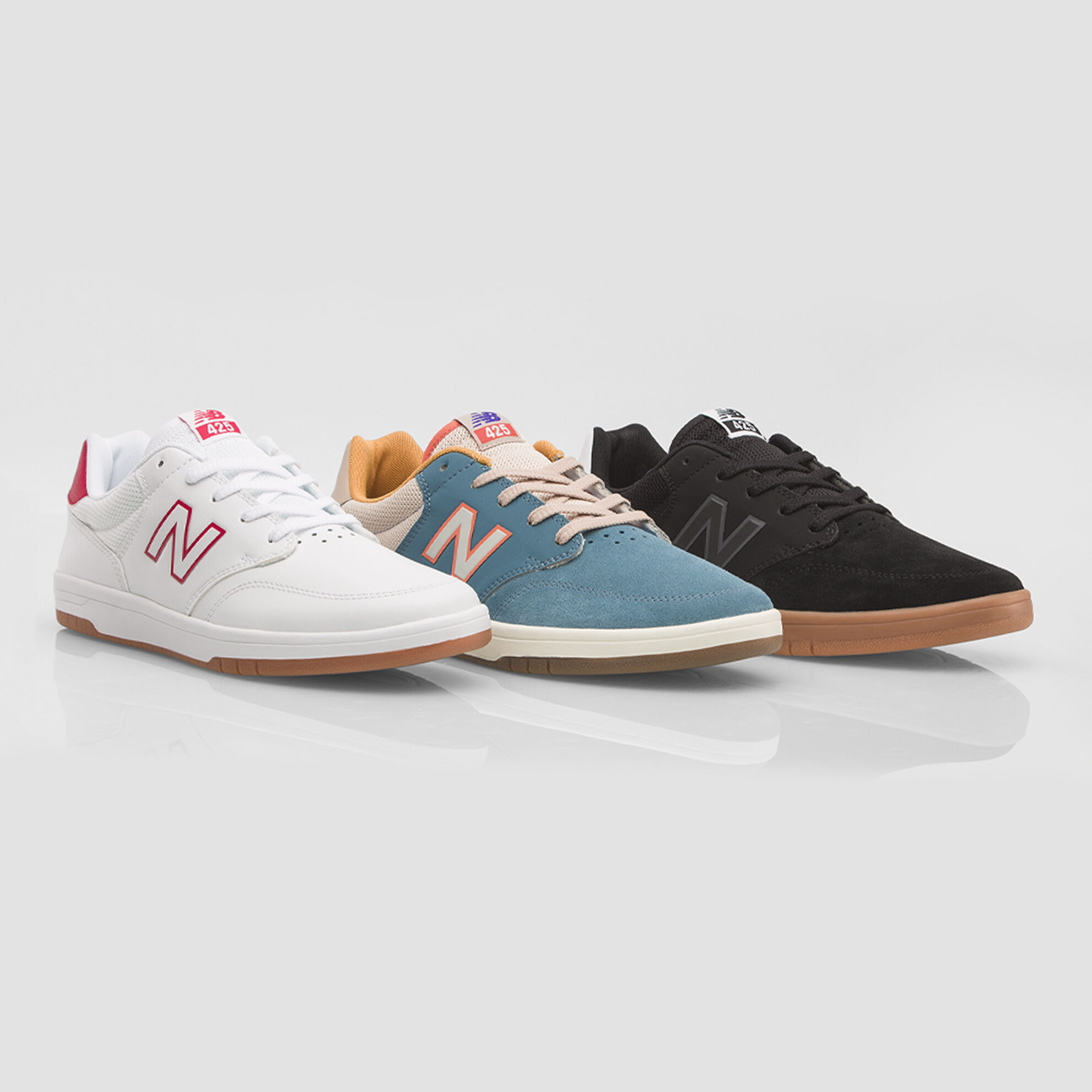 425 shoe in three colorways: white, blue, and black