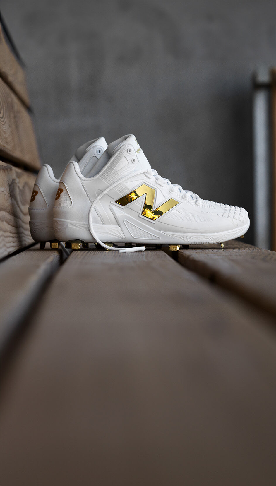 Gold and white new balance cleats sales