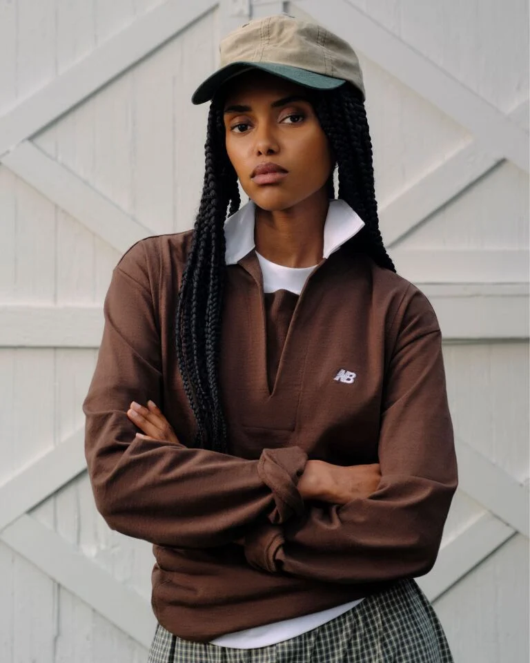 A person wearing Made in USA apparel standing in front of a barn.