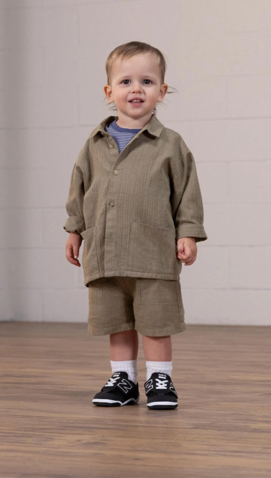 Standing toddler, wearing the New-B First