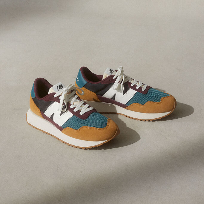 Pair of 237 shoes in burgundy, blue and tan lying on a studio background