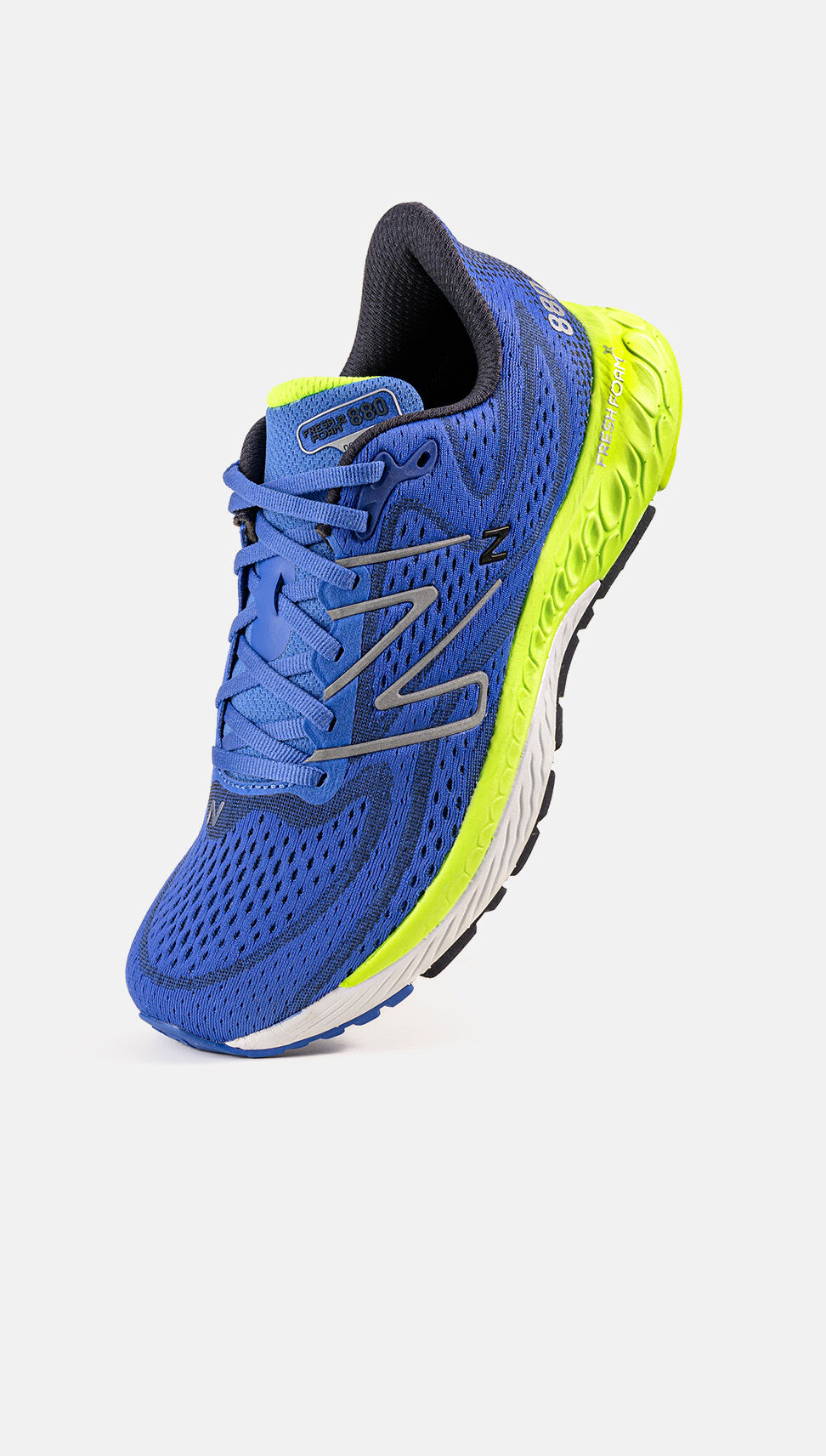 Toe-down image of a blue NB Fresh Foam X 880 with neon-green accents 