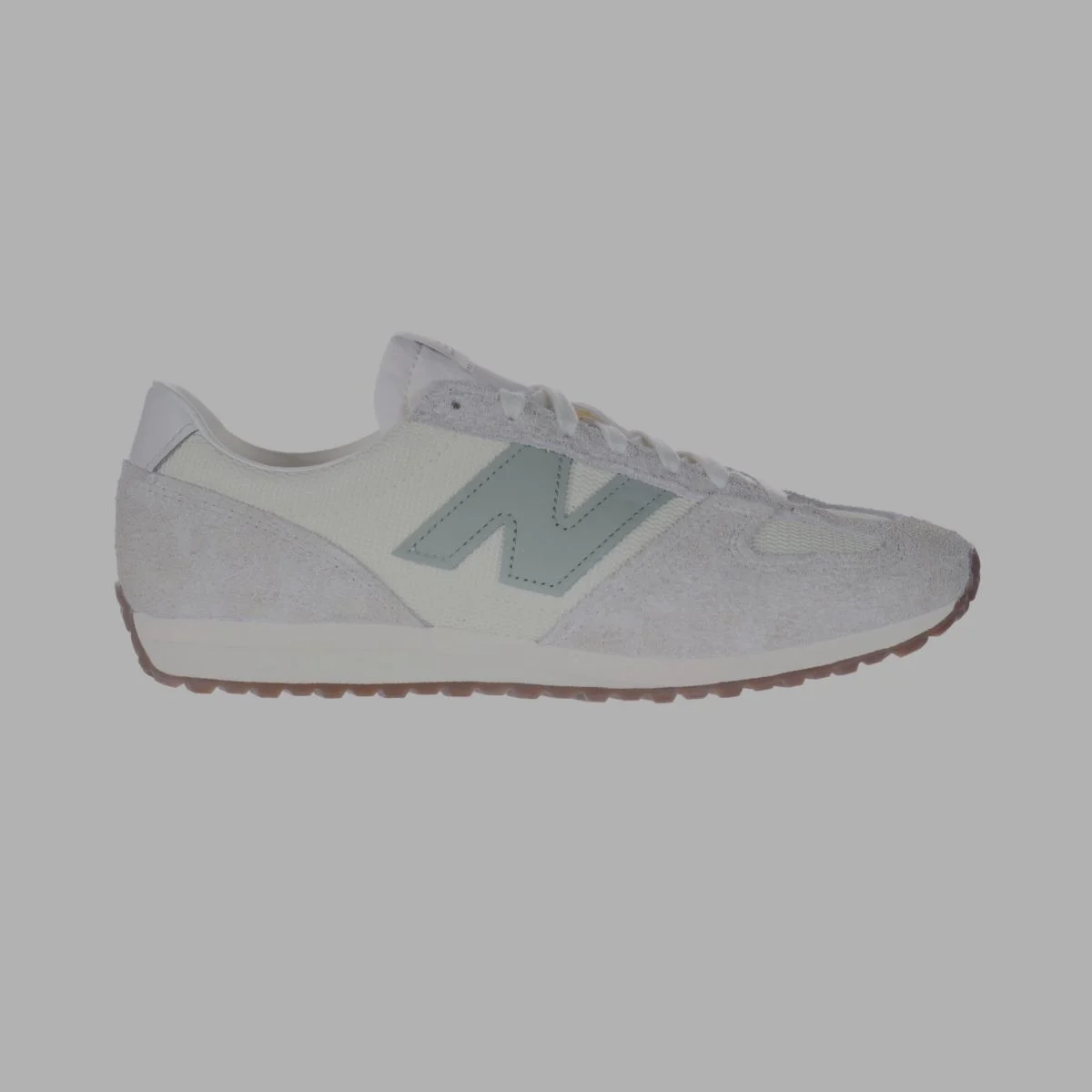 A white 471 shoe with a light green logo.