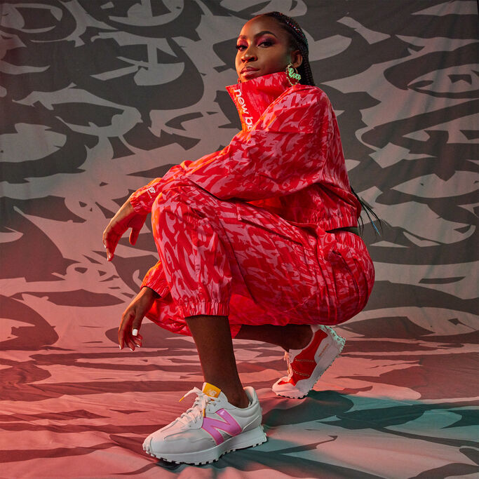 Coco Gauff wearing a pink NB matching set and 327 sneakers.