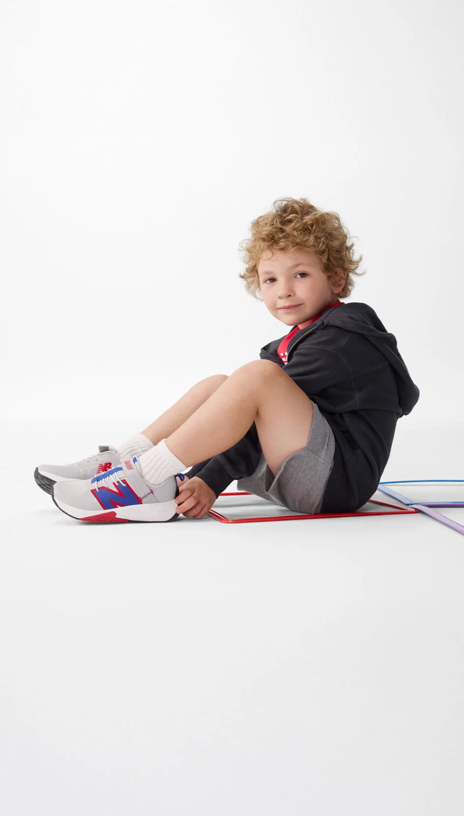 Boy sitting, wearing the FuelCell Play